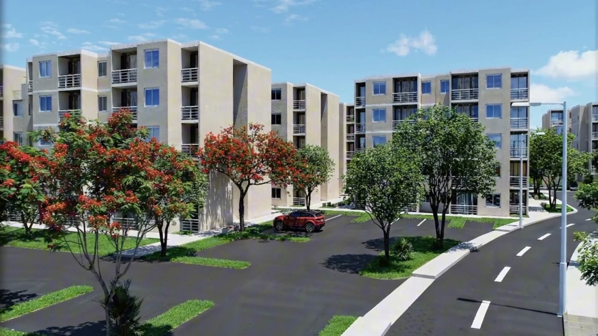 Condominio con edificios, árboles en flor y calles amplias